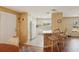 Bright kitchen with white cabinetry, countertops, appliances, and a convenient breakfast bar at 313 Mariner Dr, North Port, FL 34287