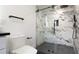 Updated bathroom with a large walk-in shower and marble tile at 4907 Parson Brown Ln, Palm Harbor, FL 34684