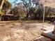 Spacious backyard with mature trees and a large grassy area at 5809 N 17Th St, Tampa, FL 33610