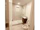 Modern bathroom with marble-tiled shower and floating vanity at 5809 N 17Th St, Tampa, FL 33610