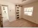 Bedroom with barn door and view into the kitchen at 5809 N 17Th St, Tampa, FL 33610