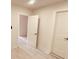 Bright hallway with wood-look floors and access to rooms at 5809 N 17Th St, Tampa, FL 33610