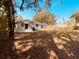Rear view of a single story house with a large backyard at 5809 N 17Th St, Tampa, FL 33610