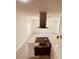 Modern kitchen with stainless steel appliances and white cabinetry at 5809 N 17Th St, Tampa, FL 33610