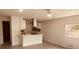 Modern kitchen featuring white cabinets, stainless steel appliances, and an island at 5809 N 17Th St, Tampa, FL 33610