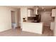 Modern kitchen featuring white cabinets, stainless steel appliances, and an island at 5809 N 17Th St, Tampa, FL 33610