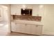 Modern kitchen with white cabinets and stainless steel appliances at 5809 N 17Th St, Tampa, FL 33610