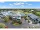 Aerial view of Tara Golf & Country Club clubhouse and golf cart parking at 6594 Fairway Gardens Dr # 6594, Bradenton, FL 34203