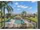 Beautiful community pool with ample seating, perfect for relaxation under sunny skies at 6594 Fairway Gardens Dr # 6594, Bradenton, FL 34203