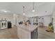 Kitchen island with a marble countertop and a sink; lots of cabinet space at 13107 Texel Ave, New Port Richey, FL 34654