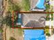 Aerial view of property featuring pool and fully fenced yard at 16605 Myrtle Sand Dr, Wimauma, FL 33598