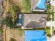 Aerial view of property featuring pool and fully fenced yard at 16605 Myrtle Sand Dr, Wimauma, FL 33598