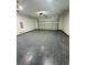 Spacious garage with sealed floor and garage door at 302 E Clay Ave, Brandon, FL 33510