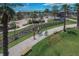 Scenic community park featuring walking paths, splash pad, and recreation areas with lush landscaping and mature trees at 5916 Jensen View Ave, Apollo Beach, FL 33572