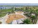 Community splash pad with interactive water features surrounded by lush landscaping and a tranquil lake view at 5916 Jensen View Ave, Apollo Beach, FL 33572