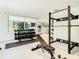 Gym featuring weight racks, a bench, dumbbells, and mirrors at 900 N Osceola Ave # 703, Clearwater, FL 33755