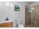 Modern bathroom with a vanity, toilet, and shower at 8514 N Mitchell Ave, Tampa, FL 33604