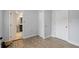 Charming bedroom with wood-look floors, and access to a bathroom at 8514 N Mitchell Ave, Tampa, FL 33604