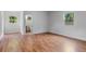 Bright bedroom with wood floors and access to bathroom at 8514 N Mitchell Ave, Tampa, FL 33604