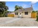 Charming bungalow features a walkway to the front entrance and a fenced yard at 8514 N Mitchell Ave, Tampa, FL 33604