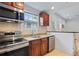 Modern kitchen with stainless steel appliances and granite countertops at 8514 N Mitchell Ave, Tampa, FL 33604