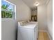 Convenient laundry room with side-by-side washer and dryer at 8514 N Mitchell Ave, Tampa, FL 33604