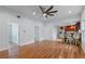 Open living space with hardwood floors and kitchen access at 8514 N Mitchell Ave, Tampa, FL 33604