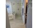 Spa-like bathroom with soaking tub, walk-in shower, and tile floors at 721 Plumbrook Rd, Sun City Center, FL 33573