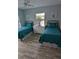 Bedroom with two twin beds, dresser, and window at 721 Plumbrook Rd, Sun City Center, FL 33573