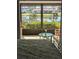 Bedroom with lake view and access to a relaxing patio at 721 Plumbrook Rd, Sun City Center, FL 33573