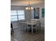 Bright dining room featuring a white table and six chairs at 721 Plumbrook Rd, Sun City Center, FL 33573