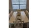 White dining table with coastal-themed centerpiece at 721 Plumbrook Rd, Sun City Center, FL 33573