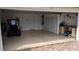 Spacious two-car garage with extra storage and golf cart at 721 Plumbrook Rd, Sun City Center, FL 33573