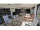 Bright sunroom with seating and views of the outdoors at 721 Plumbrook Rd, Sun City Center, FL 33573