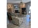 Relaxing living room with a fireplace, built in shelving and seating area at 721 Plumbrook Rd, Sun City Center, FL 33573