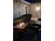 Cozy patio with fire pit and wicker furniture at 721 Plumbrook Rd, Sun City Center, FL 33573