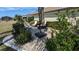 Relaxing patio with seating area, umbrella, and landscaping at 721 Plumbrook Rd, Sun City Center, FL 33573