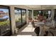 Spacious sunroom featuring lake views and comfortable seating at 721 Plumbrook Rd, Sun City Center, FL 33573