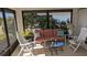 Relaxing sunroom with wicker furniture and view of the backyard at 721 Plumbrook Rd, Sun City Center, FL 33573