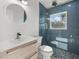 Modern bathroom with a walk-in shower and a large mirror at 15810 2Nd E St, Redington Beach, FL 33708