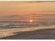 Beautiful sunset view over calm ocean waves at 15810 2Nd E St, Redington Beach, FL 33708