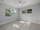 Well-lit bedroom with large windows and ceiling fan at 15810 2Nd E St, Redington Beach, FL 33708