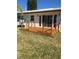New deck with stained wood and glass railings at 15810 2Nd E St, Redington Beach, FL 33708