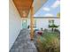 Inviting front entry with a light teal door and walkway at 15810 2Nd E St, Redington Beach, FL 33708