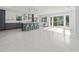 Modern kitchen with two-toned cabinetry, marble countertops, and island at 15810 2Nd E St, Redington Beach, FL 33708