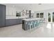 Stylish kitchen featuring gray and white cabinets and a marble island at 15810 2Nd E St, Redington Beach, FL 33708