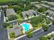 Aerial view of community with pool and townhomes at 2220 Kings Palace Dr, Riverview, FL 33578