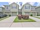 Two-story townhome with attached garage and landscaping at 2220 Kings Palace Dr, Riverview, FL 33578