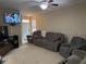 Bright living room featuring comfortable seating at 8115 Alamosa Wood Ave, Ruskin, FL 33573