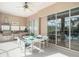 Outdoor kitchen with dining area and pool view at 331 Lewis Rd, Lithia, FL 33547